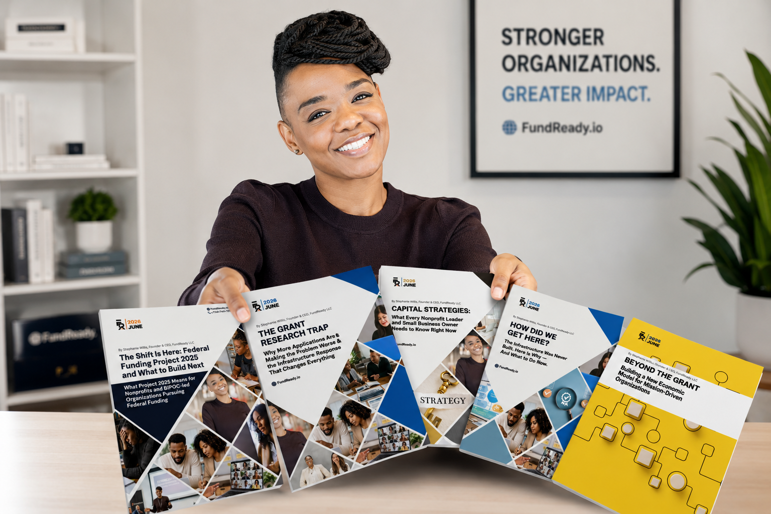 Stephanie Willis, Founder & CEO of FundReady, holding all five Capital Insights Reports